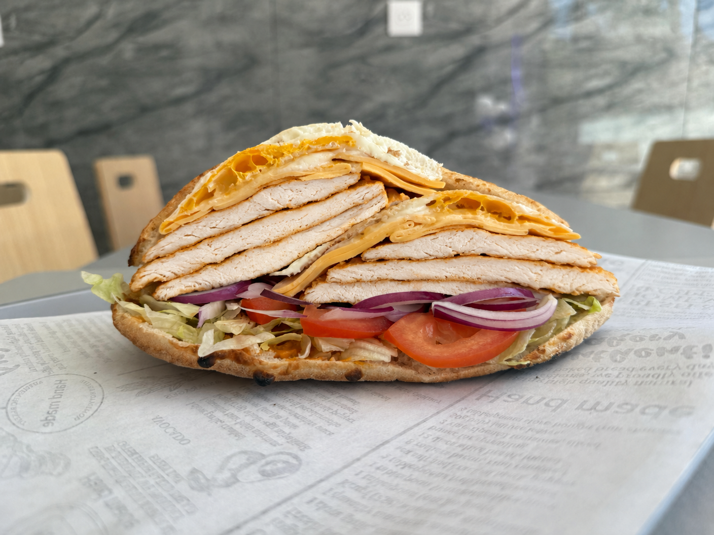 Sandwich Le Suprême : escalope, bacon, œuf et fromage
